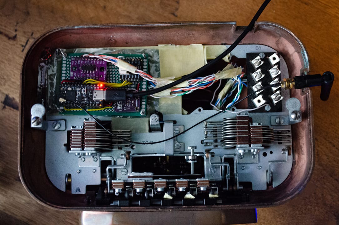 The internals of the rotary phone are shown. replaced by modern hardware